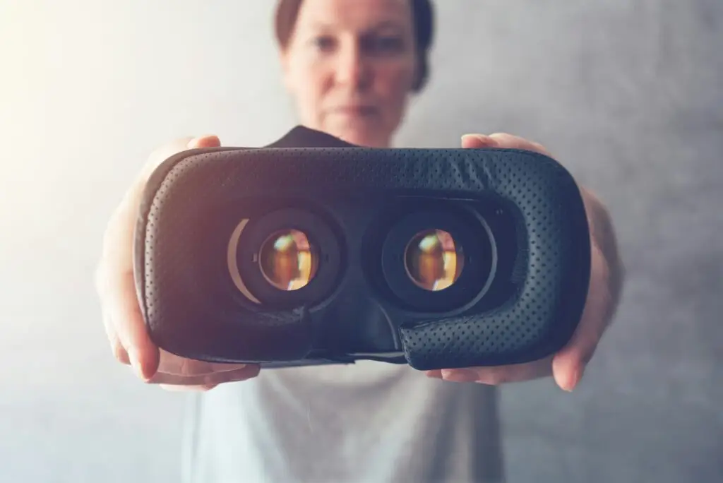 Woman offering VR headset