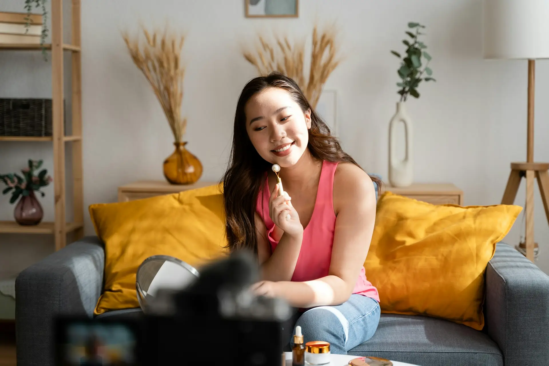 Young woman recording a cosmetology tutorial.